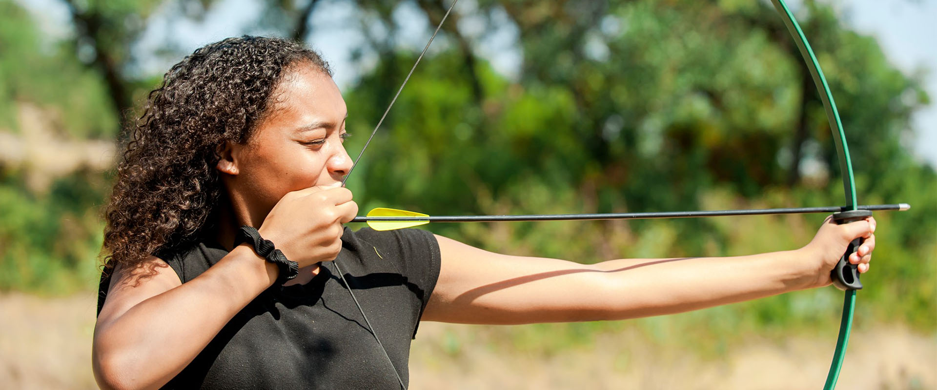 women holding bow and arrow